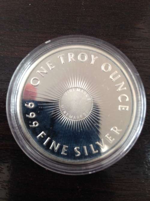 ONE TROY 1oz   SUNSHINE ROUND    IN  999.9%  PURE SOLID SILVER