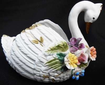 Decorative Porcelain Swan with flowers. 12 cm long