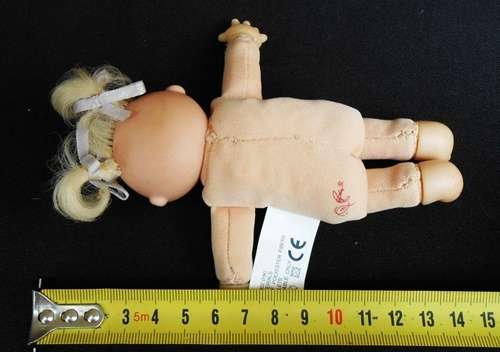 collectable Tiny Cabbage Patch doll with blond pigtails and brown eyes