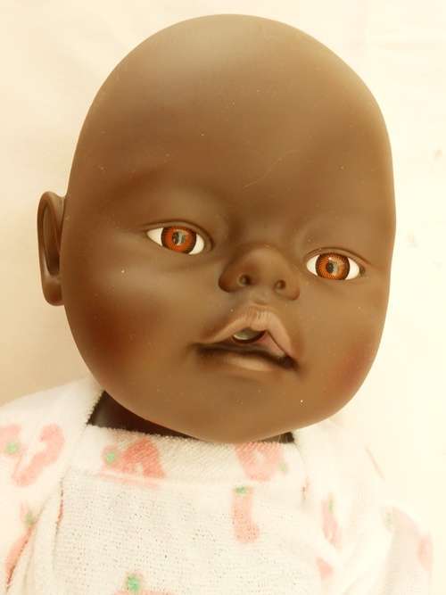 Black baby doll same size as Zapf Baby Born doll no markings