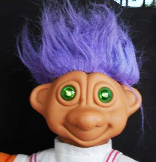 Collectable Troll doll with purple hair and soft body eyes light up