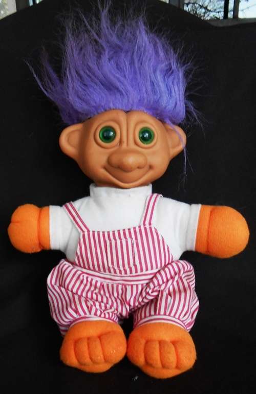Collectable Troll doll with purple hair and soft body eyes light up