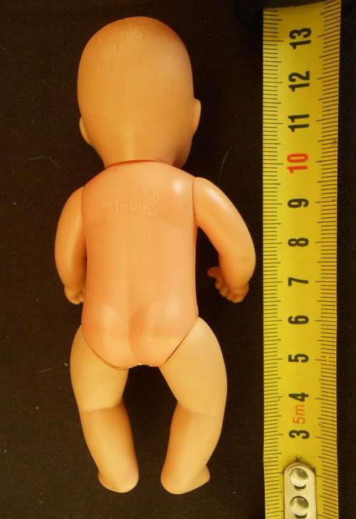 Baby Born Miniworld by Simba Mini doll in yellow dress