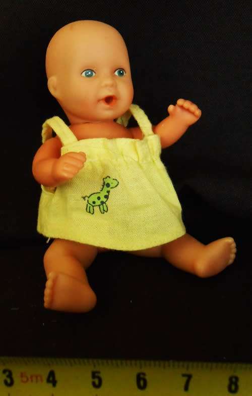 Baby Born Miniworld by Simba Mini doll in yellow dress