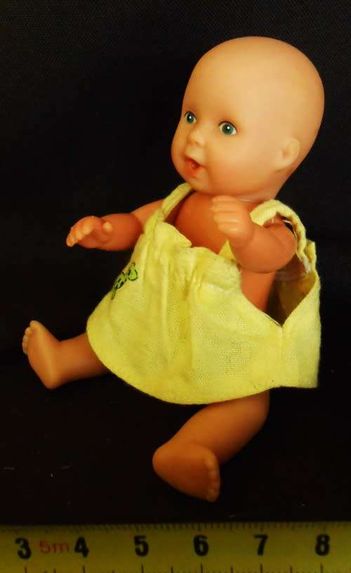 Baby Born Miniworld by Simba Mini doll in yellow dress