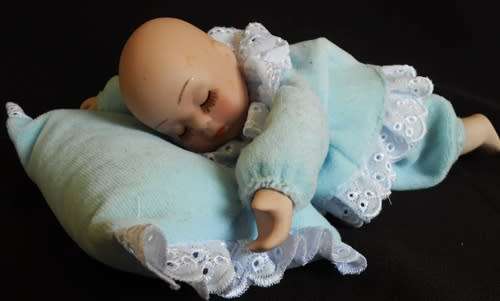 Sleeping Baby Porcelain doll with wind up music box