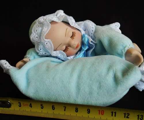 Sleeping Baby Porcelain doll with wind up music box