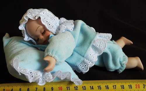 Sleeping Baby Porcelain doll with wind up music box