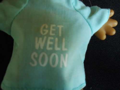 collectable troll doll by Russ Berrie in hospital gown with get well wishes