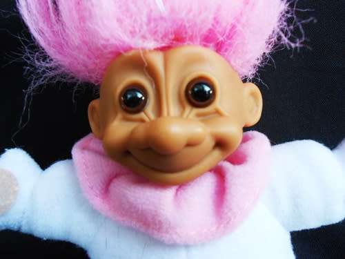 small collectable soft bodied troll doll with pink hair made by Russ