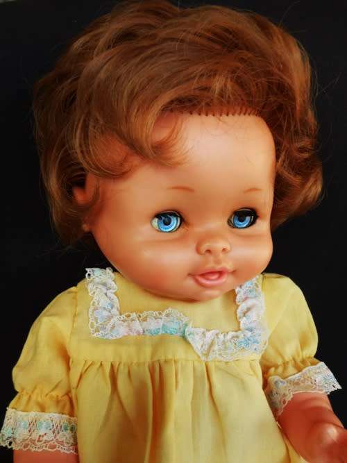 Vintage Famosa 13" Baby Girl Doll brunette Blue Eyes Yellow Outfit made in Spain