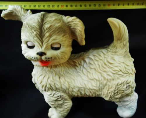 vintage 1960 s rubber puppy toy by Edward Mobley with sleep eyes.