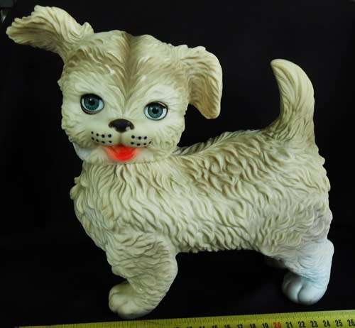 vintage 1960 s rubber puppy toy by Edward Mobley with sleep eyes.