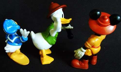 collectible disney figures mickey mouse donald duck and uncle scrooge