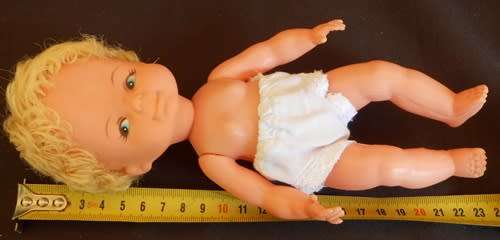 Vintage collectable hard plastic and vinyl doll with blond hair made in Hong Kong original clothes