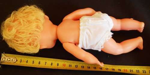 Vintage collectable hard plastic and vinyl doll with blond hair made in Hong Kong original clothes