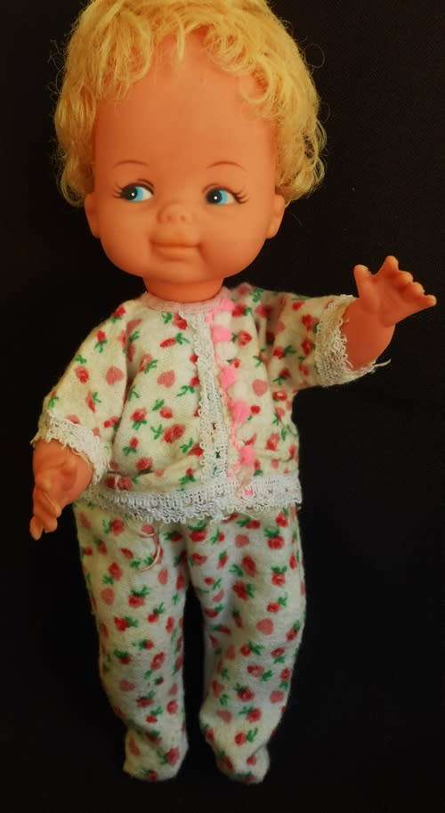 Vintage collectable hard plastic and vinyl doll with blond hair made in Hong Kong original clothes