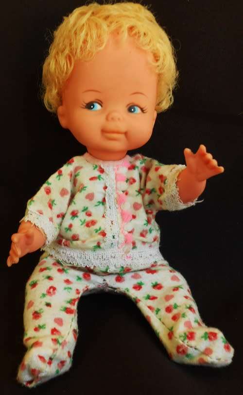 Vintage collectable hard plastic and vinyl doll with blond hair made in Hong Kong original clothes