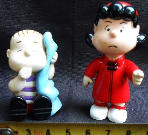 collectable peanuts figurines Lucy and Linus made for Colgate Palmolive