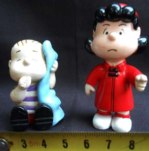 collectable peanuts figurines Lucy and Linus made for Colgate Palmolive