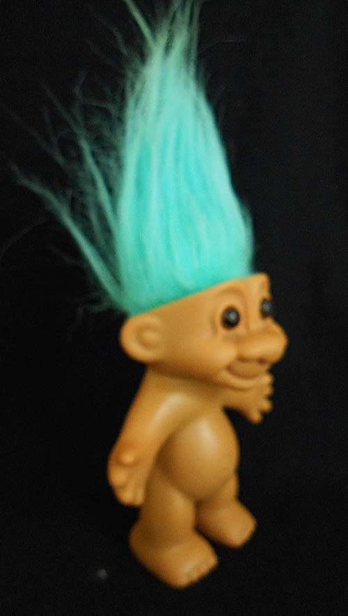 collectable vintage troll doll with turquoise hair