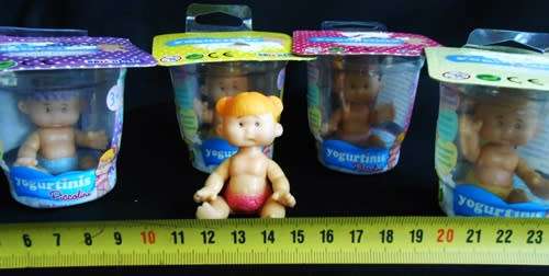 Collectable four Yogurtinis dolls clad in diapers New in Packet
