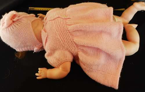 Vintage Collectable Soft bodied Baby doll in knitted dress.