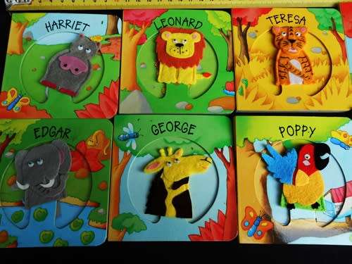 set of nine baby books with animal finger puppets