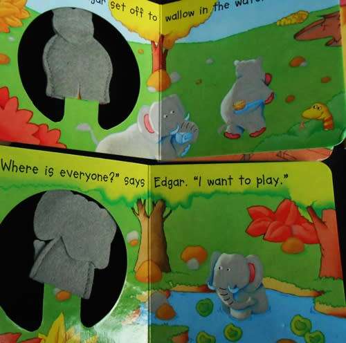 set of nine baby books with animal finger puppets