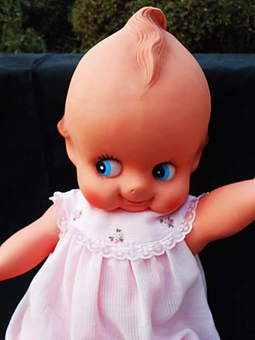 Collectable large Vintage Kewpie Doll in pink dress