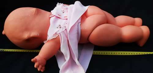 Collectable large Vintage Kewpie Doll in pink dress