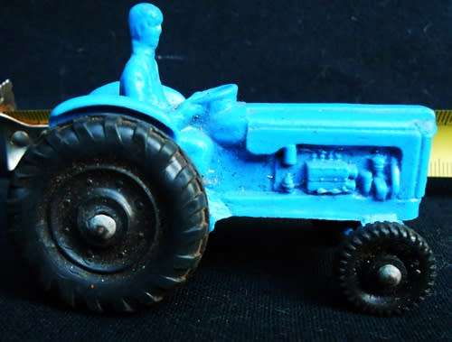 Collectable Small Tomte Laerdal Ford tractor in blue 1:64