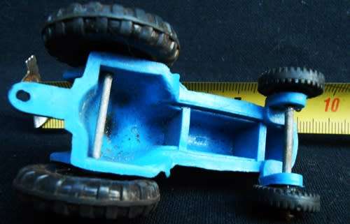 Collectable Small Tomte Laerdal Ford tractor in blue 1:64