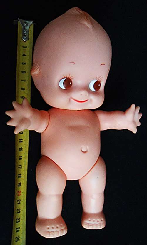 vintage Kewpie doll with brown eyes and wings