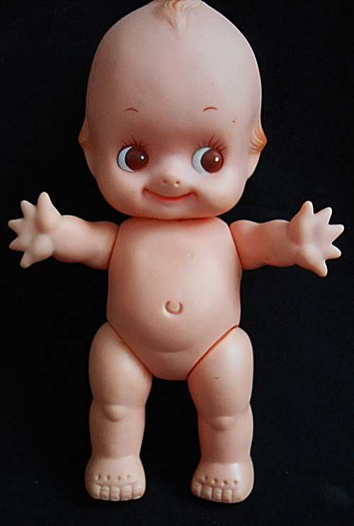 vintage Kewpie doll with brown eyes and wings