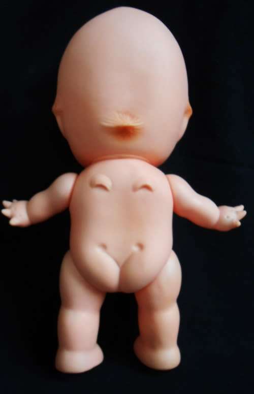 vintage Kewpie doll with brown eyes and wings