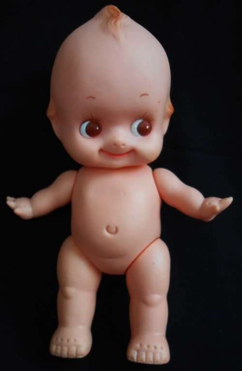 vintage Kewpie doll with brown eyes and wings