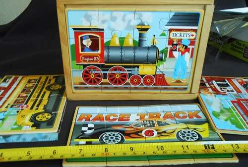 Set of four wooden jigsaw puzzles 12 pieces each in a handy storage box like new