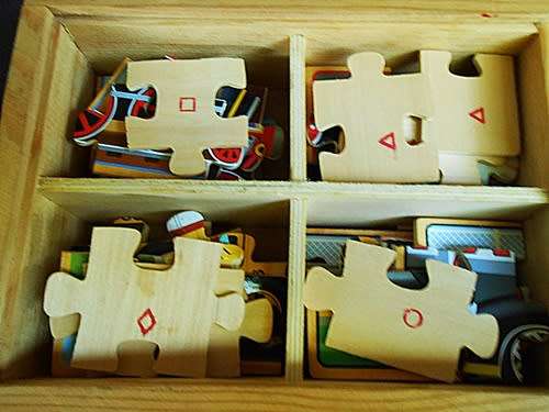 Set of four wooden jigsaw puzzles 12 pieces each in a handy storage box like new