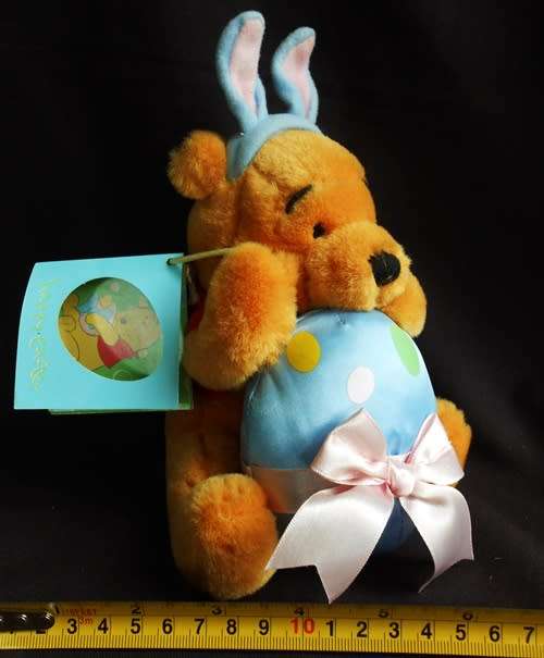 collectable Winnie the Pooh Teddy Bear dressed as Easter Bunny with egg