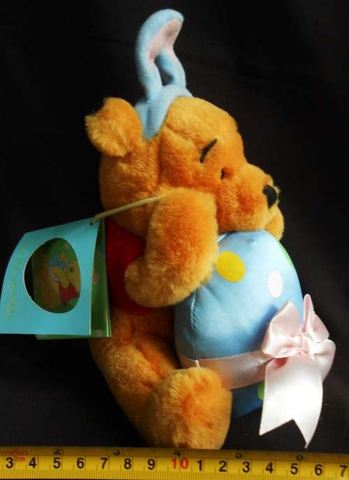 collectable Winnie the Pooh Teddy Bear dressed as Easter Bunny with egg