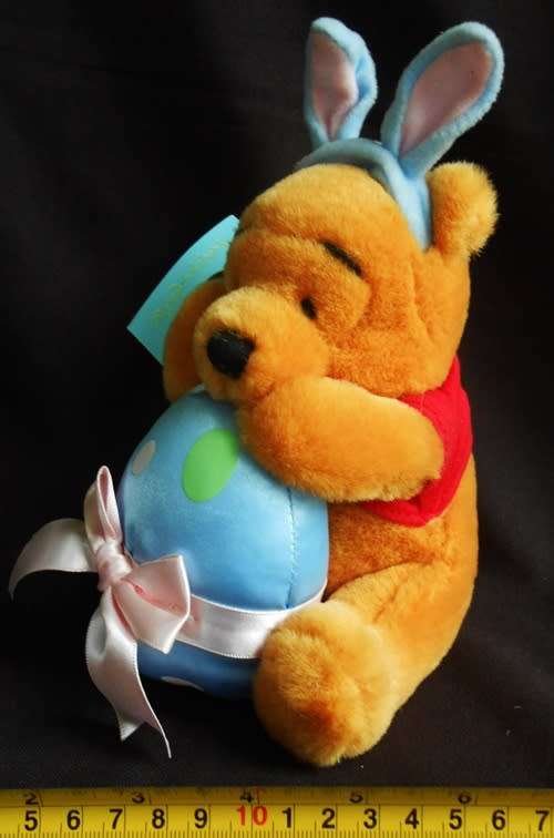 collectable Winnie the Pooh Teddy Bear dressed as Easter Bunny with egg