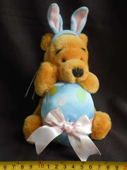 collectable Winnie the Pooh Teddy Bear dressed as Easter Bunny with egg