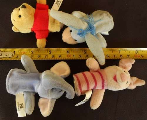 collectable Winnie the Pooh four mini plush finger puppets Disney made for Woolworths
