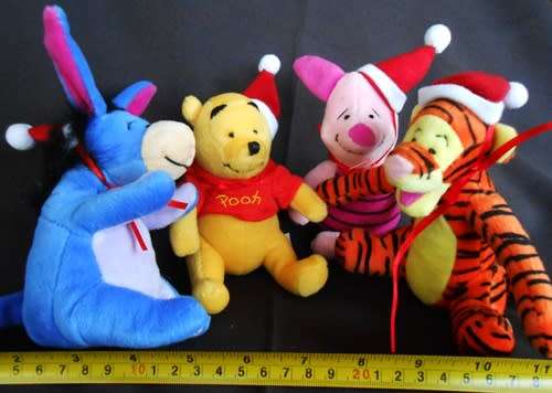 Collectable set of four Winnie the Pooh plush characters in a Christmas mood. made for woolworths