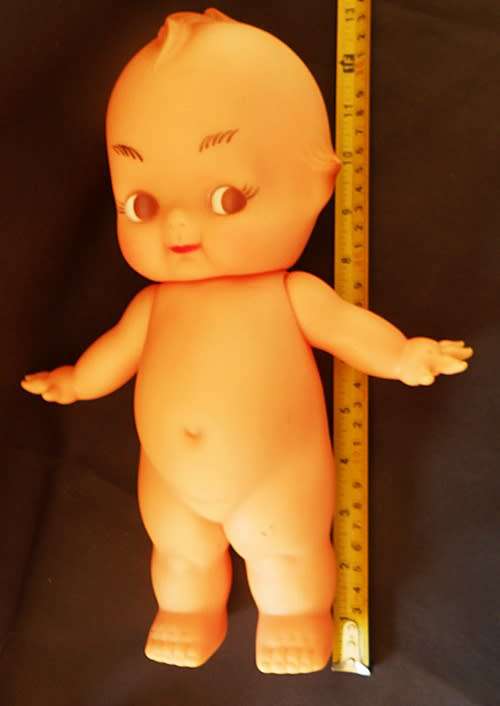 Vintage Kewpie Doll with brown eyes. 31 cm high