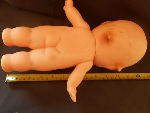 Vintage Kewpie Doll with brown eyes. 31 cm high