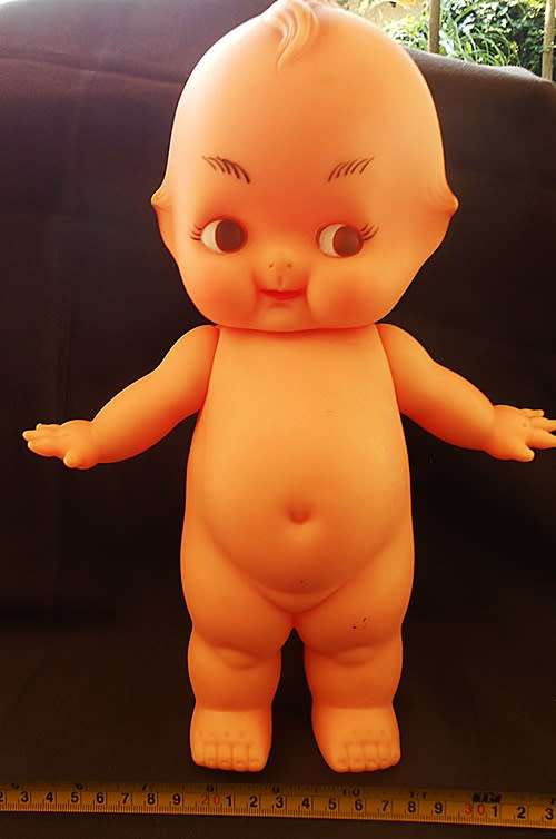 Vintage Kewpie Doll with brown eyes. 31 cm high