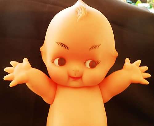 Vintage Kewpie Doll with brown eyes. 31 cm high