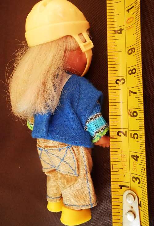 collectable mini Doll Evie Love by Simba in original outfit with helmet and matching yellow shoes